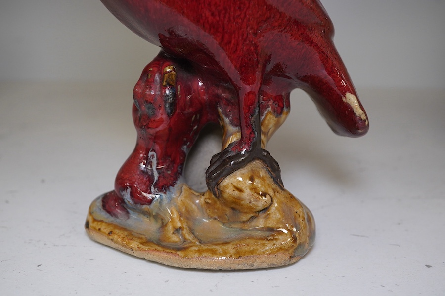 A Chinese flambé glazed figure of a bird, 20.5cm high. Condition - fair to good.